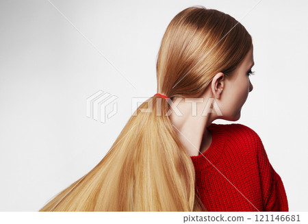 Woman with Straight Blond Hair, Tied in Ponytail, Wearing Red Knitted Pullover. Beautiful Gold Hair in Pony Tail Woman with Straight Blond Hair, Tied in Ponytail, Wearing Red Knitted Pullover. Beautiful Gold Hair in Pony Tail 121146681