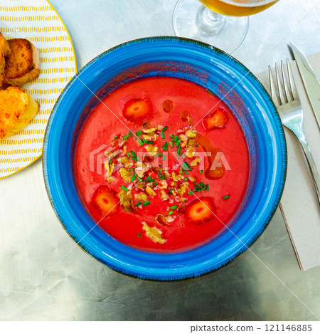 Beetroot salmorejo with walnuts and strawberry 121146885