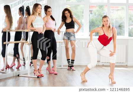 Adult woman shows high heels dance to group 121146895