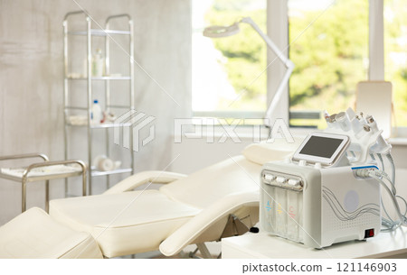 Aesthetic medicine clinic office with a treatment chair and a hydrogen-oxygen cosmetology apparatus Aesthetic medicine clinic office with a treatment chair and a hydrogen-oxygen cosmetology apparatus 121146903