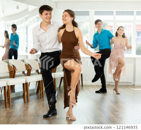 Couple young woman and man dancing twist 121146935