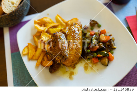 Chicken with stewed vegetables and potatoes 121146959