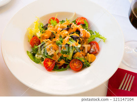 Appetizing sea salad with Seafood Cocktail 121147104