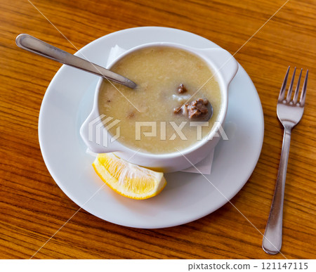 Turkish soup Paca corbasi served with lemon slice Turkish soup Paca corbasi served with lemon slice 121147115