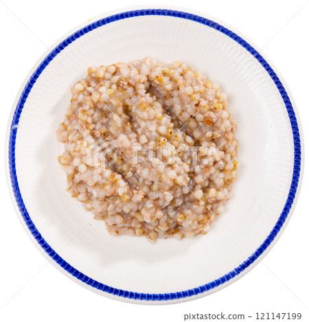 Plate of tasty buckwheat porridge on dining table Plate of tasty buckwheat porridge on dining table 121147199