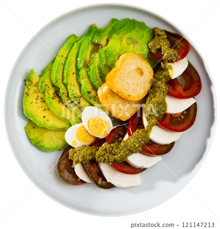 Caprese salad served with avocado and eggs Caprese salad served with avocado and eggs 121147213