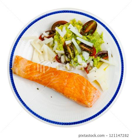 Fried salmon fillet and vegetable side dish, guacamole paste, slices of cheese and tomato slices Fried salmon fillet and vegetable side dish, guacamole paste, slices of cheese and tomato slices 121147282