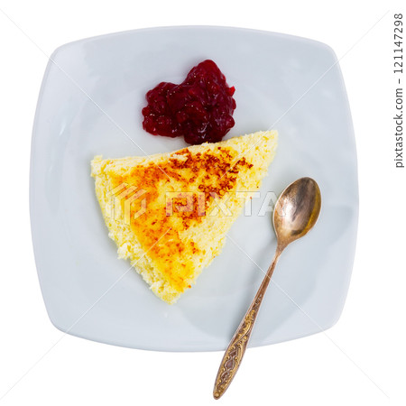 Delicious cottage cheese casserole with cherry or raspberry jam closeup Delicious cottage cheese casserole with cherry or raspberry jam closeup 121147298