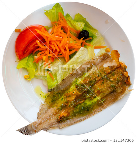 There is plate with fried solea flatfish and salad of fresh veg on wooden table. There is plate with fried solea flatfish and salad of fresh veg on wooden table. 121147306