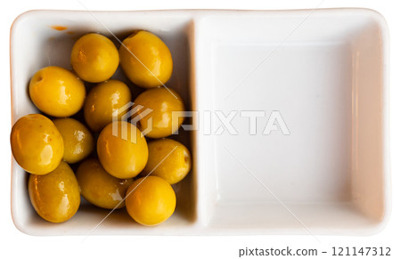 Green olives with pits served in bowl Green olives with pits served in bowl 121147312