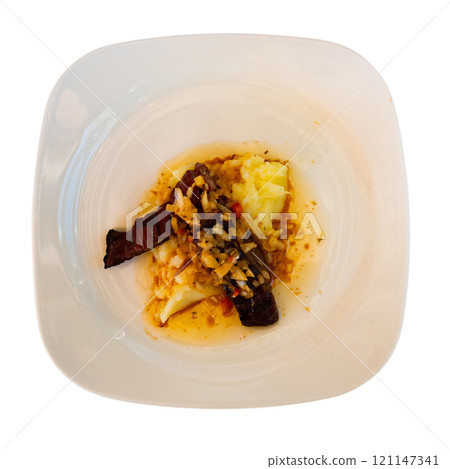 Dish of day from chef of restaurant is beef jerky with Creole sauce, garnished with mashed potatoes 121147341