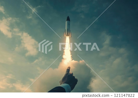 A hand pointing at a rocket in the sky A hand pointing at a rocket in the sky 121147822