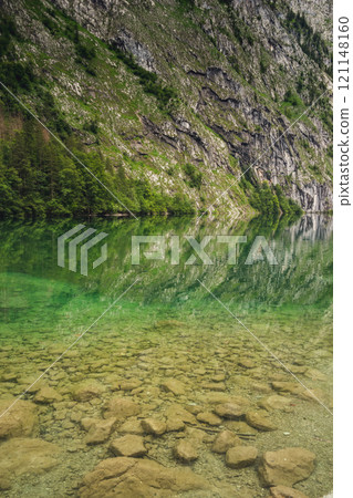Konigssee Lake in Bavaria Germany with Church by the Lake White Boat Forested Mountain and Beautiful Sunny Trekking in Berchtesgaden German Alps. High quality photo 121148160