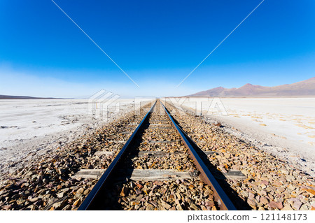 Train tracks on Bolivian salar 121148173