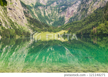 Konigssee Lake in Bavaria Germany with Church by the Lake White Boat Forested Mountain and Beautiful Sunny Trekking in Berchtesgaden German Alps. High quality photo 121148271