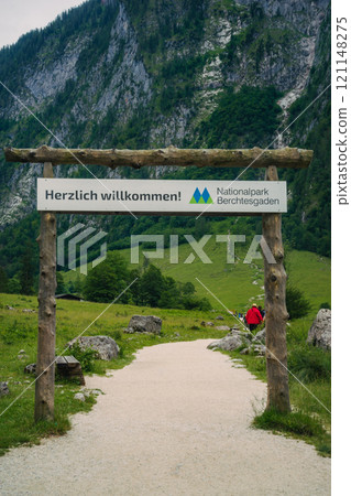 Konigssee Lake in Bavaria Germany with Church by the Lake White Boat Forested Mountain and Beautiful Sunny Trekking in Berchtesgaden German Alps. High quality photo Konigssee Lake in Bavaria Germany with Church by the Lake White Boat Forested Mountain and Beautiful Sunny Trekking in Berchtesgaden German Alps. High quality photo 121148275