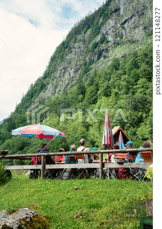 Wood house by the mountain Konigssee Lake in Bavaria Germany with Church by the Lake White Boat Forested Mountain and Beautiful Sunny Trekking in Berchtesgaden German Alps. High quality photo Wood house by the mountain Konigssee Lake in Bavaria Germany with Church by the Lake White Boat Forested Mountain and Beautiful Sunny Trekking in Berchtesgaden German Alps. High quality photo 121148277