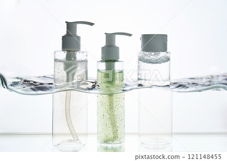 A bottle of cosmetic product in water. 121148455