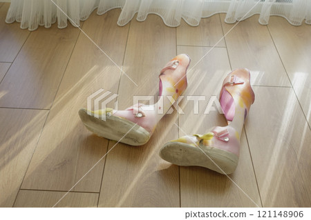 Colorful Child Orthopedic Braces on a wooden floor Colorful Child Orthopedic Braces on a wooden floor 121148906