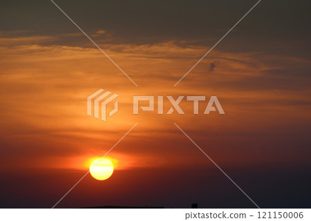 Bright sun against the background of red clouds. Bright sun against the background of red clouds. 121150006