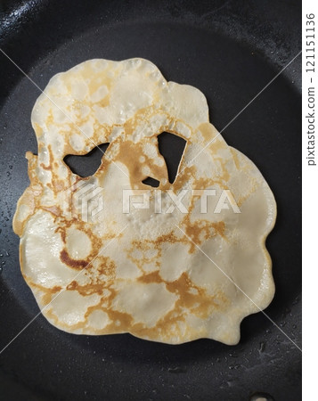 Flatbread pancake with funny eyes 121151136