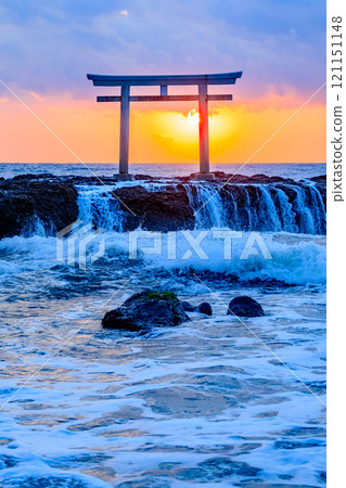 Autumnal torii gates and sunrise at Kamiiso, low tide, Oarai Town, Ibaraki Prefecture Autumnal torii gates and sunrise at Kamiiso, low tide, Oarai Town, Ibaraki Prefecture 121151148