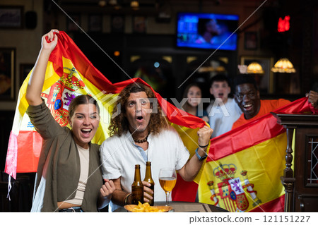 Happy fans celebrating the victory of Spanish team in bar 121151227