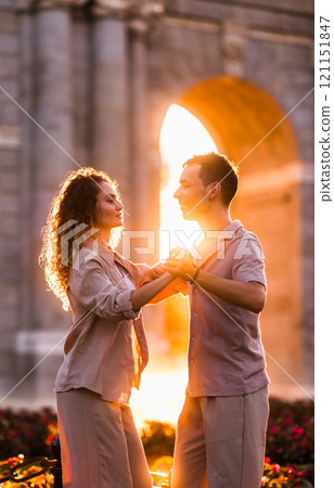 Couple dancing swing at puerta de alcala in madrid at sunset Couple dancing swing at puerta de alcala in madrid at sunset 121151847