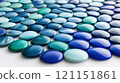 Blue and turquoise glass pebbles arranged in a pattern create a soothing visual effect, AI 121151861