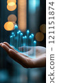 Hand holding a holographic bar graph with blurred city lights in the background, AI 121151874