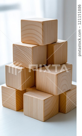 Wooden blocks stacked in a pyramid shape on a white surface, showcasing natural wood grain, AI 121151886