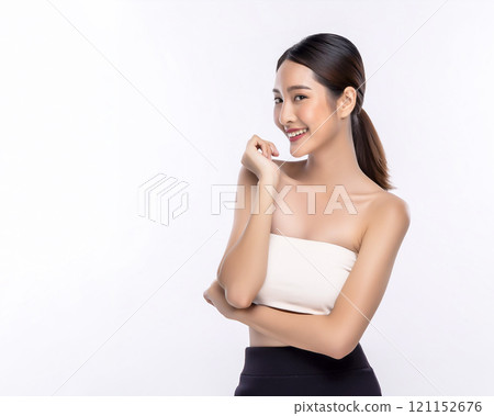 Image of a young woman feeling the moisture in her skin 121152676