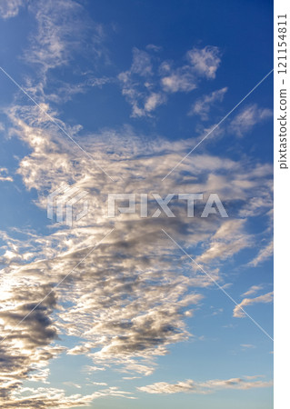 Clouds shining in the sun's oblique rays [Sunset scenery as background material] 121154811