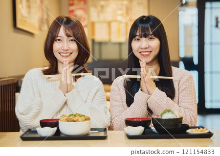 Women eating seafood bowls. Photo courtesy of Peer Bandai. Women eating seafood bowls. Photo courtesy of Peer Bandai. 121154833