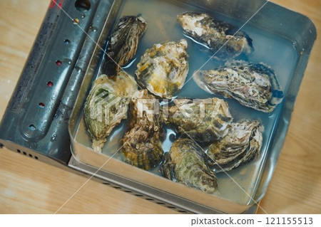 Shucking oysters Photo courtesy of Pier Bandai Shucking oysters Photo courtesy of Pier Bandai 121155513