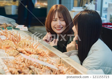 Women enjoying the fish market. Photo courtesy of Pier Bandai. Women enjoying the fish market. Photo courtesy of Pier Bandai. 121155723