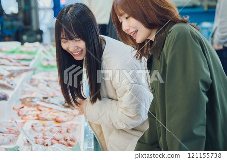 Women enjoying the fish market. Photo courtesy of Pier Bandai. Women enjoying the fish market. Photo courtesy of Pier Bandai. 121155738