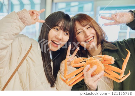 Women enjoying the fish market. Photo courtesy of Pier Bandai. 121155758