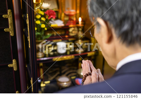 A man visiting a grave A man visiting a grave 121155846