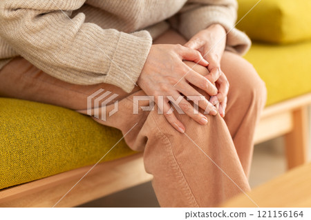 Middle-aged to senior women suffering from knee pain Middle-aged to senior women suffering from knee pain 121156164