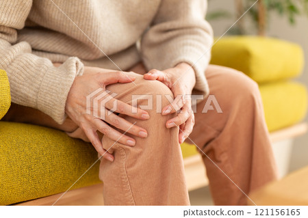 Middle-aged to senior women suffering from knee pain Middle-aged to senior women suffering from knee pain 121156165