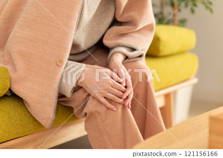 Middle-aged to senior women suffering from knee pain 121156166