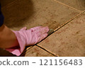 Cleaning the floor tiles 121156483