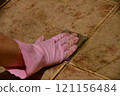 Cleaning the floor tiles 121156484