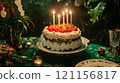 colorful cake with candles, surrounded by festive decorations and greenery 121156817