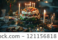 festive cake adorned with candles and fruits, perfect for celebrations 121156818