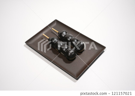 Black sesame paste rice dumplings on a plate 121157021