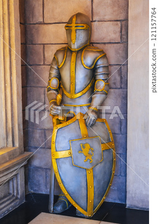 statue of medieval European knight in armor with sword and shield in castle statue of medieval European knight in armor with sword and shield in castle 121157764
