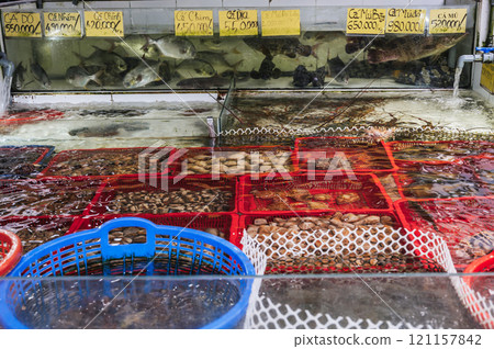 A variety of fresh seafood in aquariums at the street market 121157842