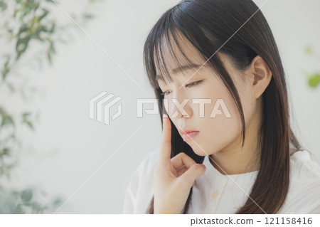 Young woman worried about skin care 121158416